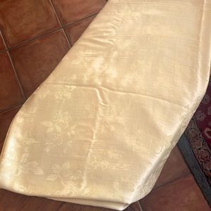 Elegant tone on tone pale yellow tablecloth